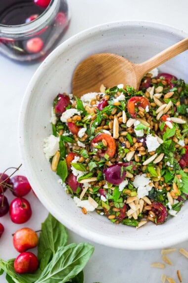 Pickled Cherry Salad with farro, almonds, goat cheese, and fresh herbs tossed in a Vanilla Balsamic Dressing.