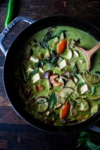 An easy authentic recipe for Thai Green Curry with eggplant and your choice of tofu, chicken or shrimp. A fast and easy weeknight dinner that can be made in 30 minutes! Use store-bought green curry paste or make your own homemade green curry paste.