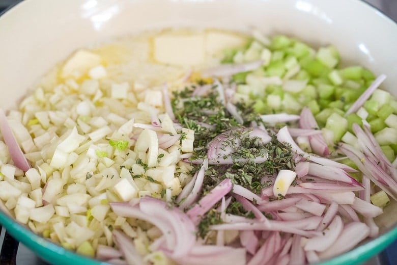 sautéing vegetables, shallot, fennel, celery, and fresh herbs, in butter in skillet.