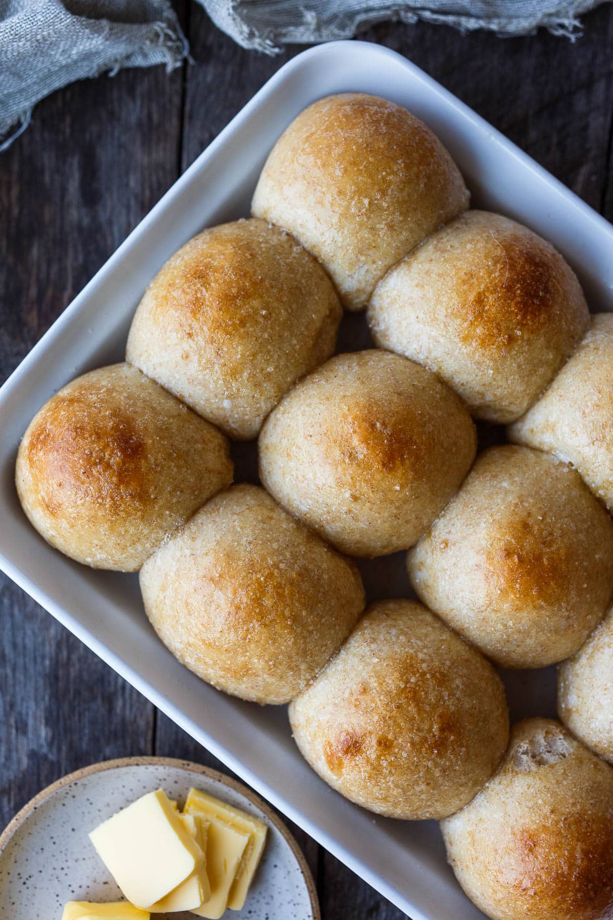 Perfectly tender and ultra flavorful sourdough dinner rolls are made completely with active starter, no yeast. Make in one day or refrigerate overnight. They freeze well and are vegan adaptable!